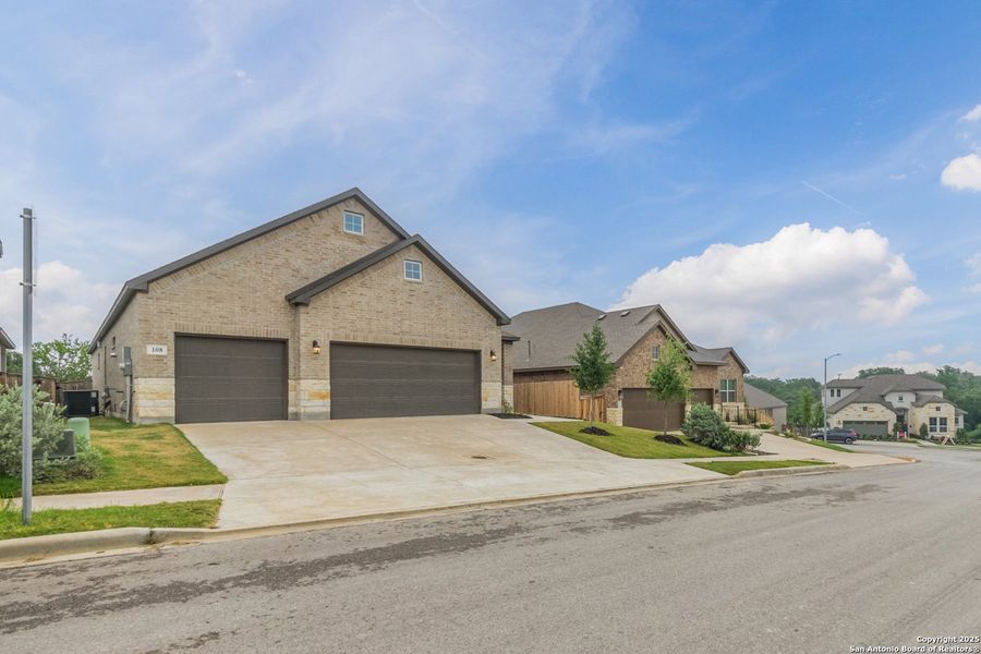 Front exterior of a new home in Cibolo Crossing, Universal City, TX, highlighting curb appeal (Image 28).