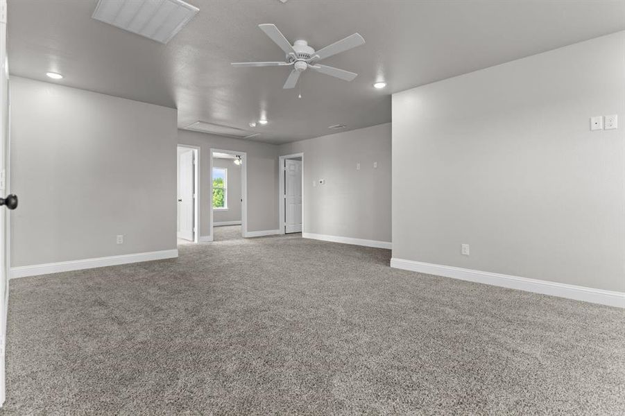 Empty room featuring carpet, ceiling fan, baseboards, and recessed lighting Empty room featuring carpet, ceiling fan, baseboards, and recessed lighting