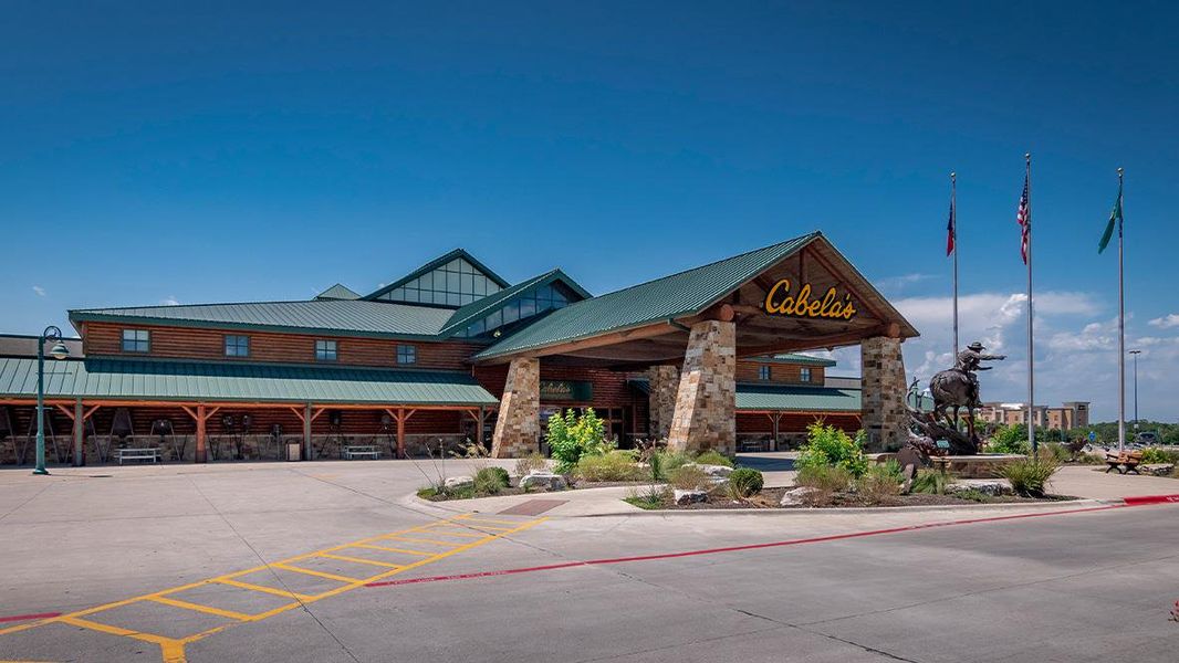 Front exterior of a new home in Paramount, Kyle, TX, highlighting curb appeal (Image 2).