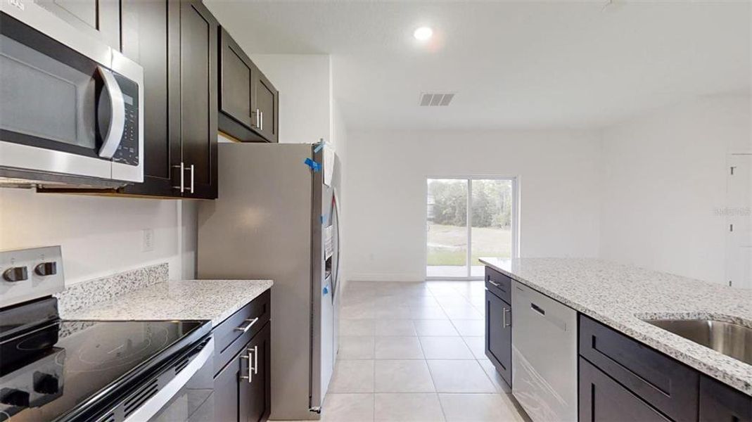 Furnished interior view inside a new home in , Dunnellon (Image 8).