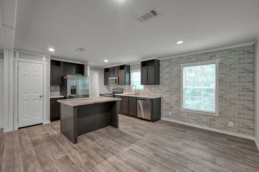 Furnished interior view inside a new home in , New Waverly (Image 5).