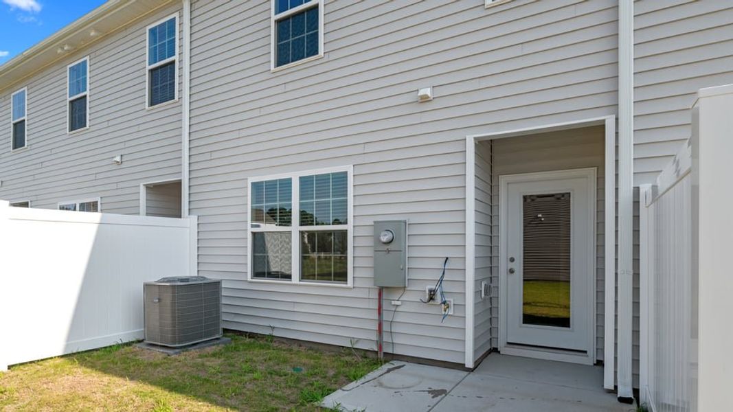 Exterior details and patio area of a home in The Townes at Ridgewood Farms, Winterville (Image 19).