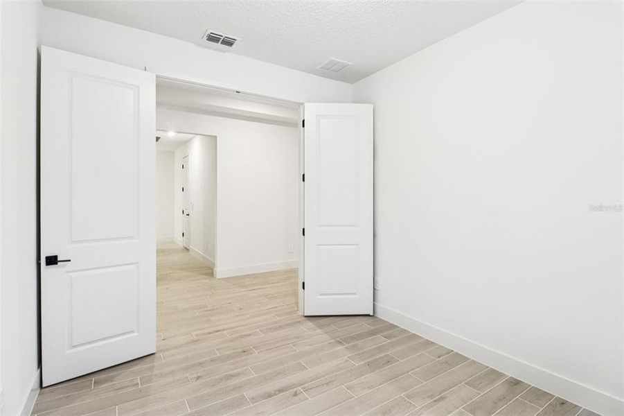 Spacious, unfurnished interior of a new home in Ridgehaven - Reserve Series, Ormond Beach (Image 27).