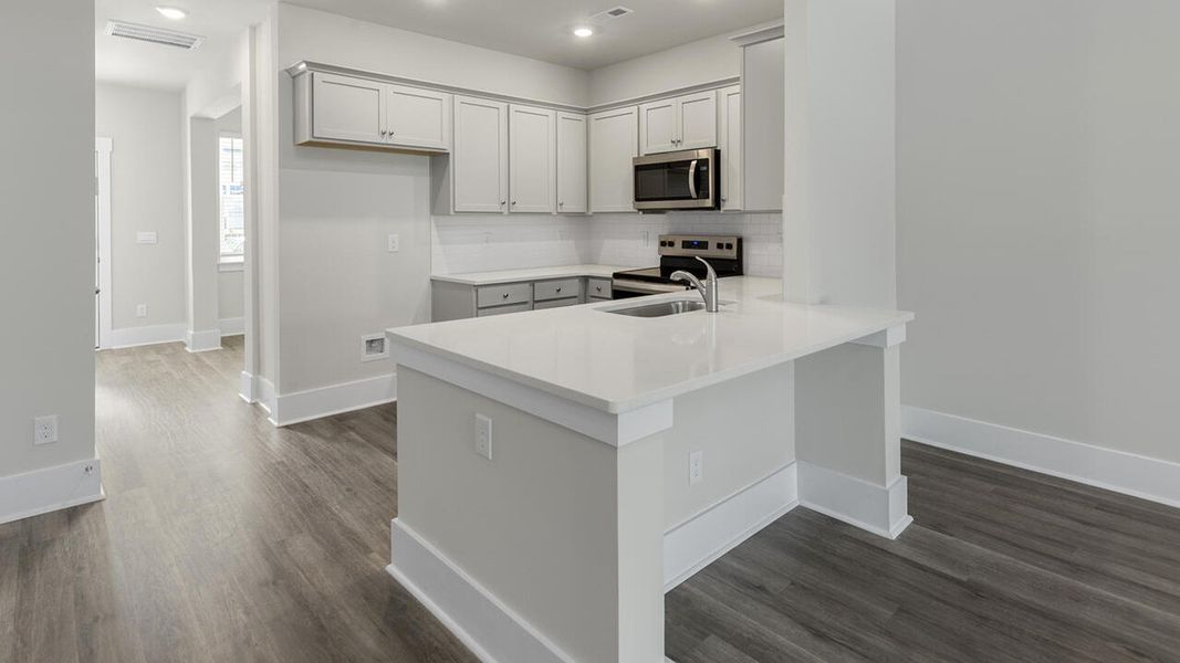Furnished interior view inside a new home in The Palms at Indigo Preserve Townhomes, Leland (Image 5). Furnished interior view inside a new home in The Palms at Indigo Preserve Townhomes, Leland (Image 5).