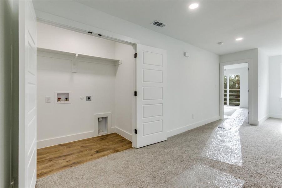Laundry area with light colored carpet, recessed lighting, washer hookup, gas dryer hookup, and hookup for an electric dryer
