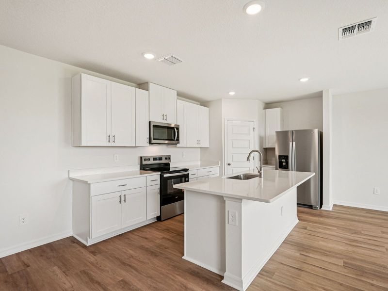 Furnished interior view inside a new home in Two Rivers - Premier Series, Zephyrhills (Image 5).