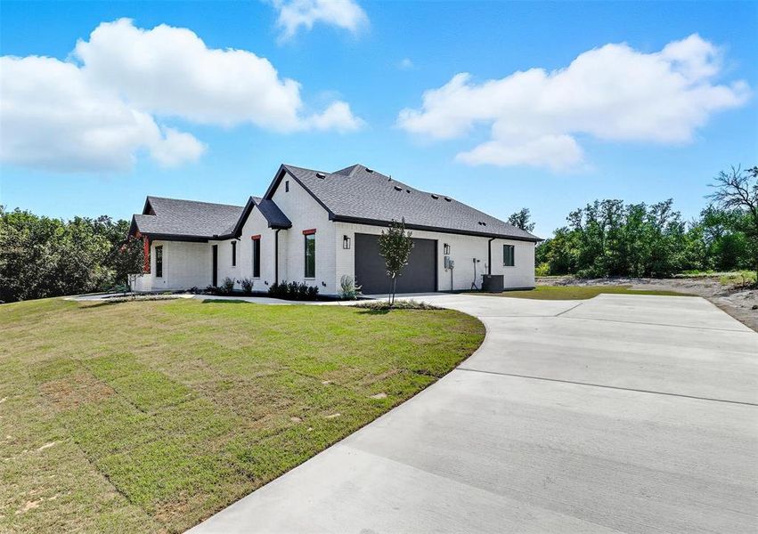 Front exterior of a new home in , Weatherford, TX, highlighting curb appeal (Image 27). Front exterior of a new home in , Weatherford, TX, highlighting curb appeal (Image 27).