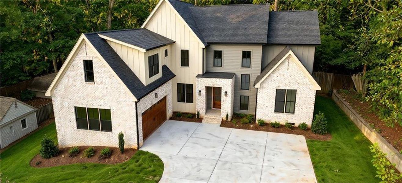 Front exterior of a new home in , Buford, GA, highlighting curb appeal (Image 1). Front exterior of a new home in , Buford, GA, highlighting curb appeal (Image 1).