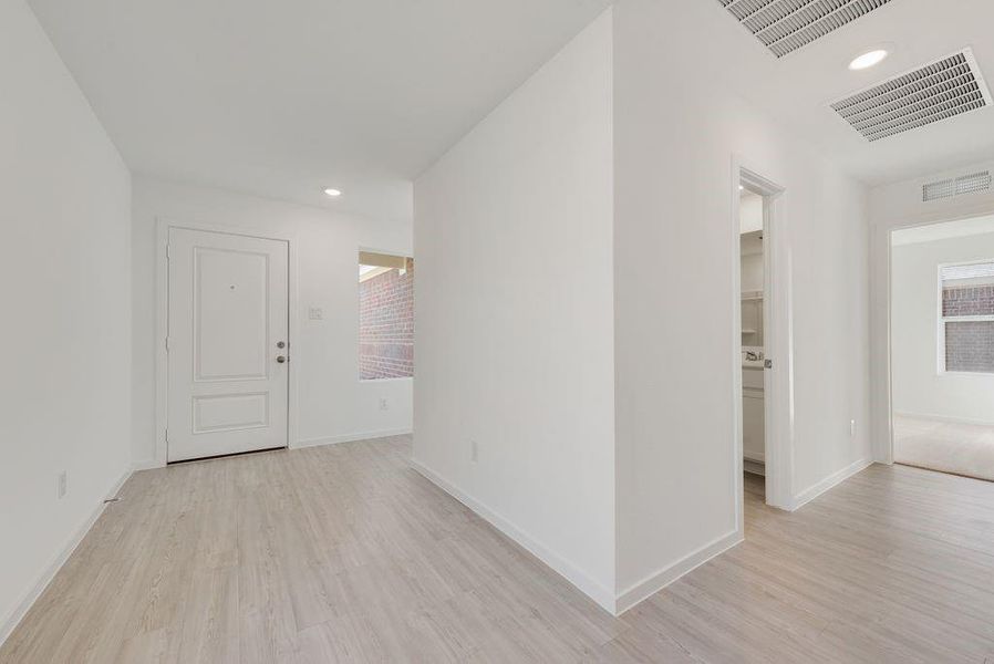 Corridor featuring recessed lighting and light wood-style floors