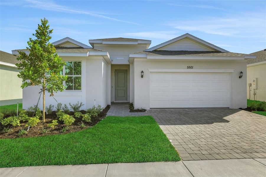 Front exterior of a new home in Brystol North at Wylder, Port St. Lucie, FL, highlighting curb appeal (Image 16).