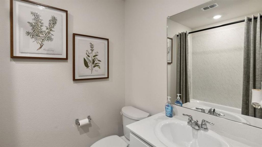 Bathroom with vanity and a shower with curtain