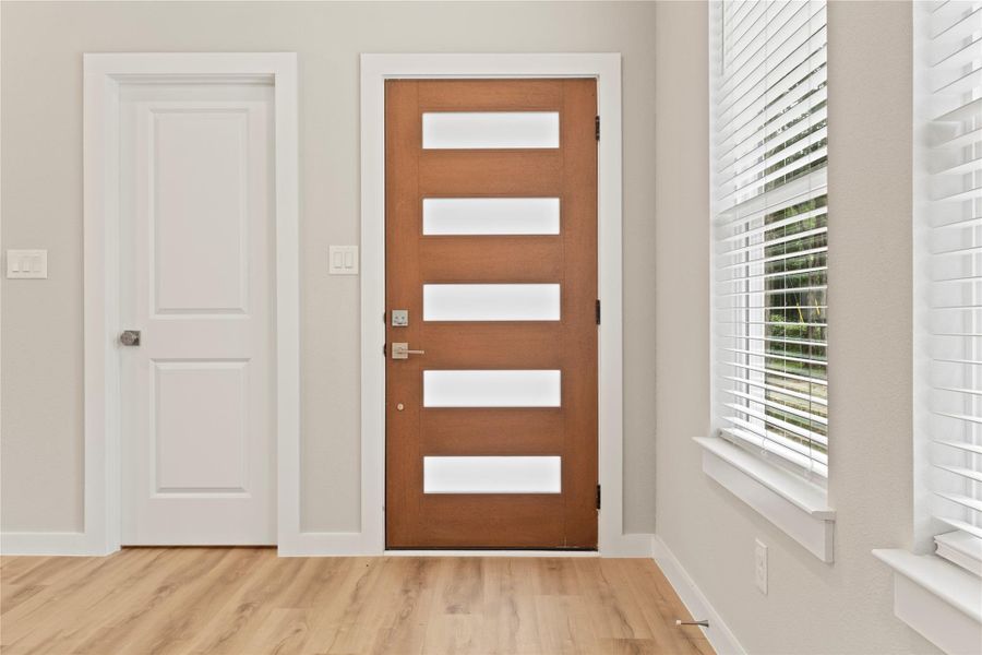 A stunning entrance with elegant details, flooding the open floor plan with natural light. A stunning entrance with elegant details, flooding the open floor plan with natural light.