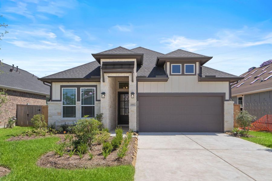 Front exterior of a new home in Mulberry Farms, Santa Fe, TX, highlighting curb appeal (Image 28).