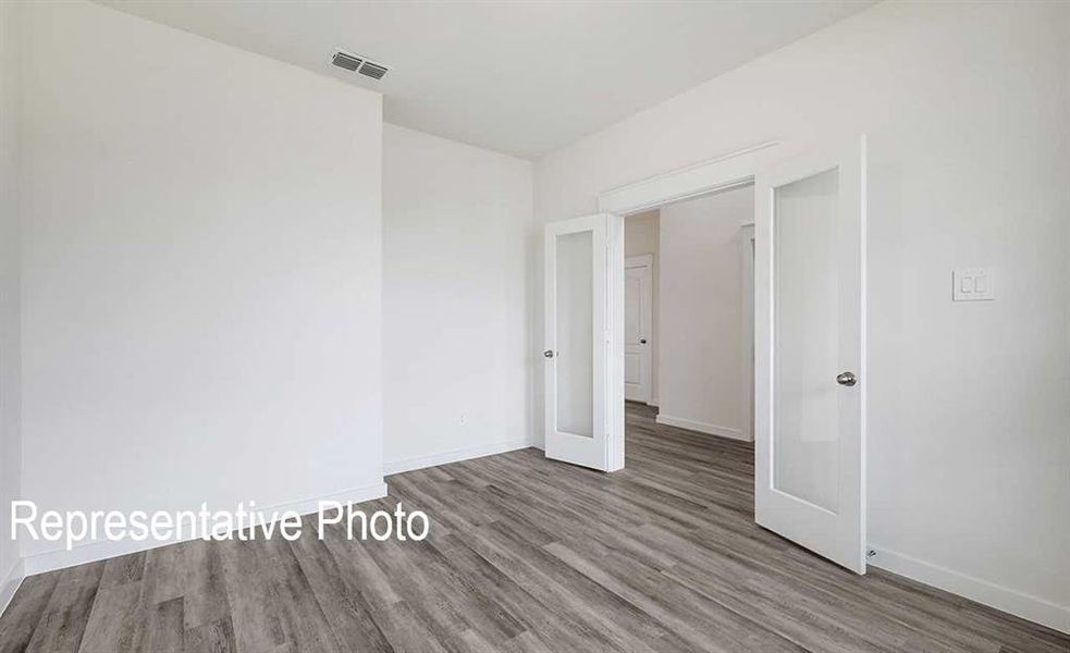 Unfurnished bedroom featuring light hardwood / wood-style flooring