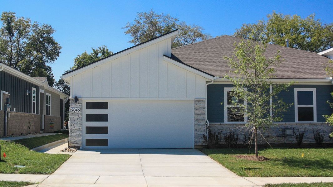 Front exterior of a new home in Nexus South, Gallatin, TN, highlighting curb appeal (Image 2). Front exterior of a new home in Nexus South, Gallatin, TN, highlighting curb appeal (Image 2).