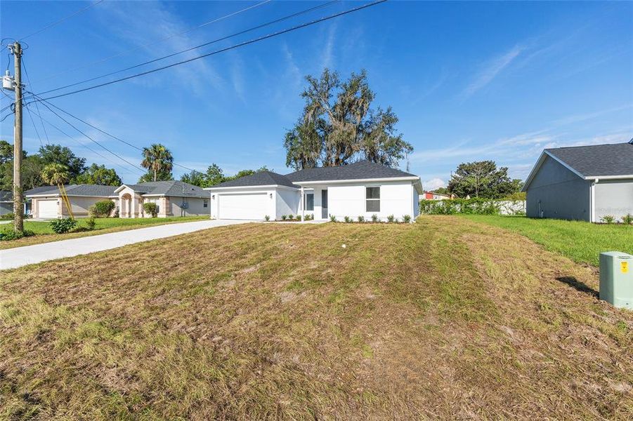 Front exterior of a new home in , Silver Springs, FL, highlighting curb appeal (Image 21). Front exterior of a new home in , Silver Springs, FL, highlighting curb appeal (Image 21).