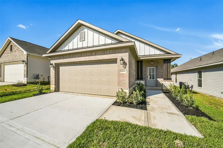 Front exterior of a new home in Mostyn Springs, Magnolia, TX, highlighting curb appeal (Image 1). Front exterior of a new home in Mostyn Springs, Magnolia, TX, highlighting curb appeal (Image 1).