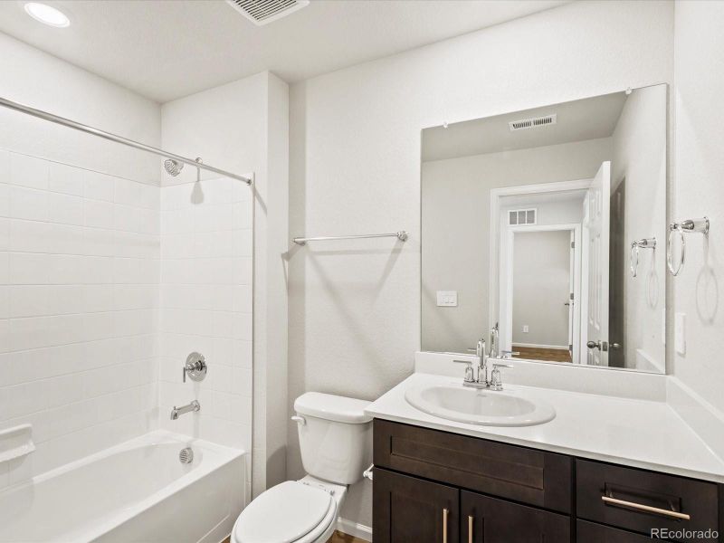 Furnished interior view inside a new home in Skyview at High Point, Aurora (Image 9).