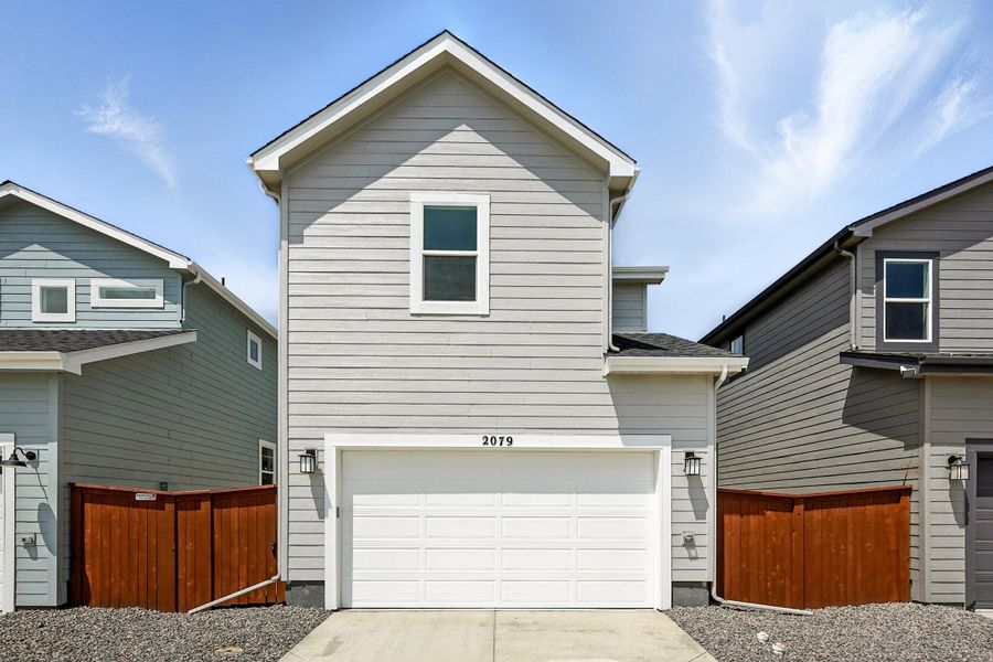 Front exterior of a new home in Farmlore, Brighton, CO, highlighting curb appeal (Image 2). Front exterior of a new home in Farmlore, Brighton, CO, highlighting curb appeal (Image 2).