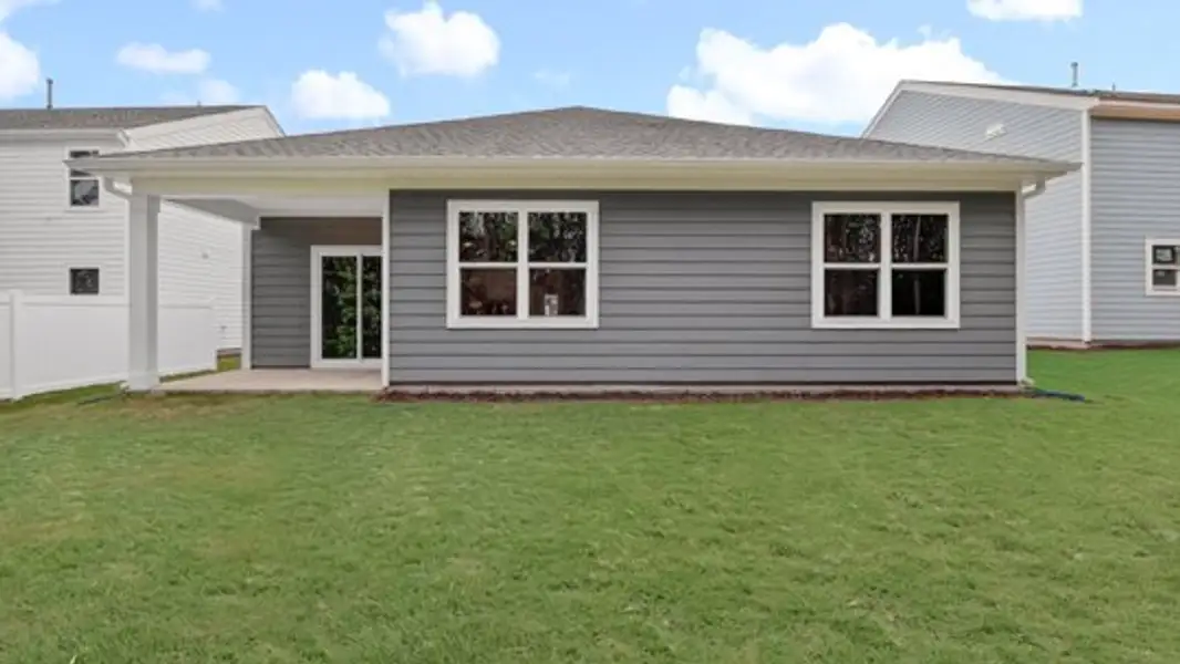 Exterior details and patio area of a home in East Ridge, Ayden (Image 25).