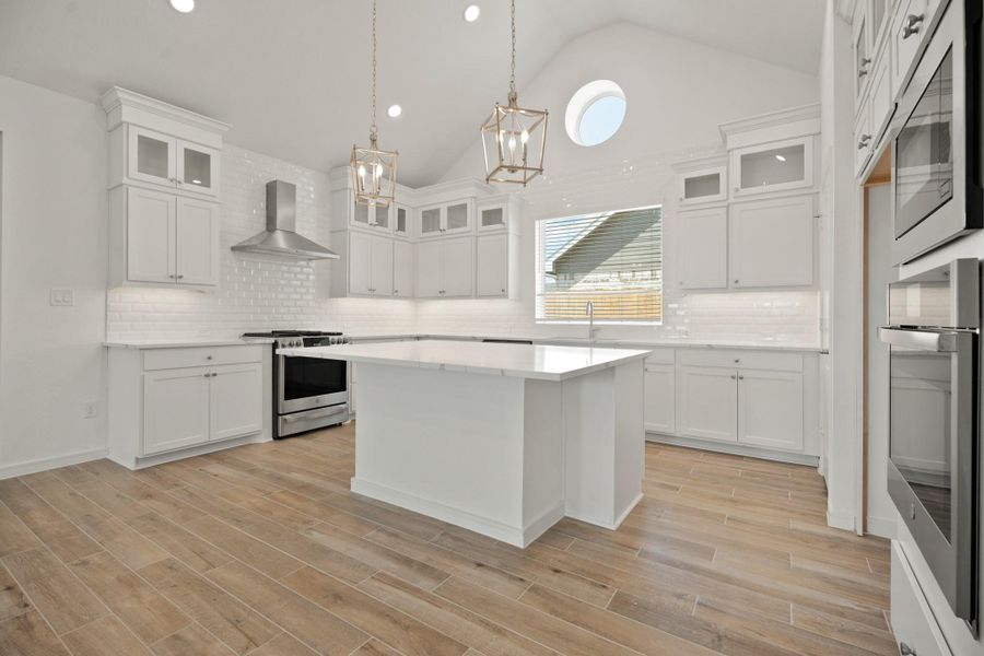 Stylish kitchen with white stacked cabinets and quartz countertops (*Photo not of actual home and used for illustration purposes only.) Stylish kitchen with white stacked cabinets and quartz countertops (*Photo not of actual home and used for illustration purposes only.)