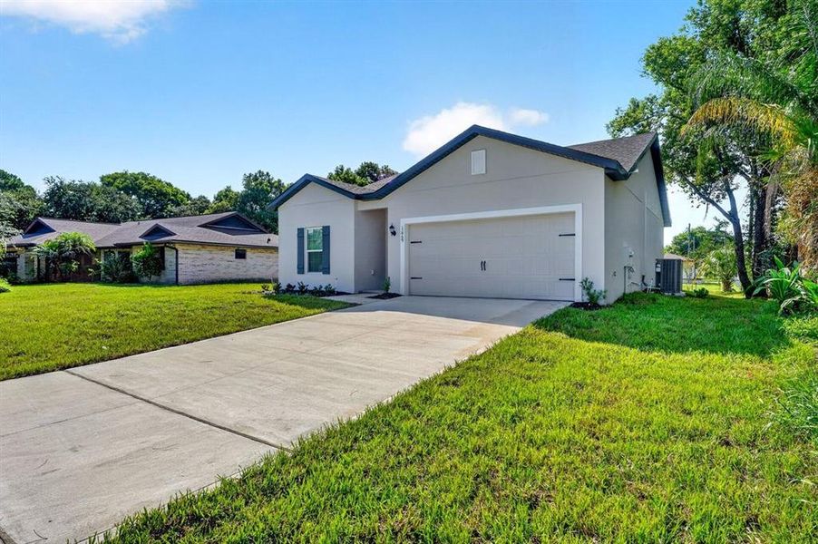 Front exterior of a new home in , Deltona, FL, highlighting curb appeal (Image 2). Front exterior of a new home in , Deltona, FL, highlighting curb appeal (Image 2).