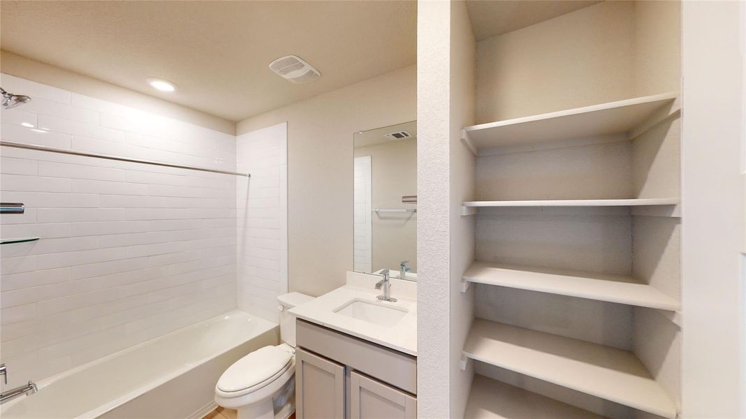 Full bathroom featuring vanity and shower / washtub combination