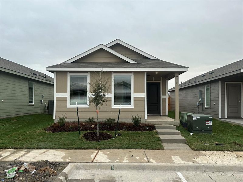 Bungalow-style home featuring a front lawn