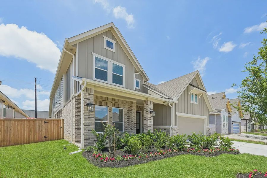 Front exterior of a new home in Wood Leaf Reserve, Tomball, TX, highlighting curb appeal (Image 22). Front exterior of a new home in Wood Leaf Reserve, Tomball, TX, highlighting curb appeal (Image 22).