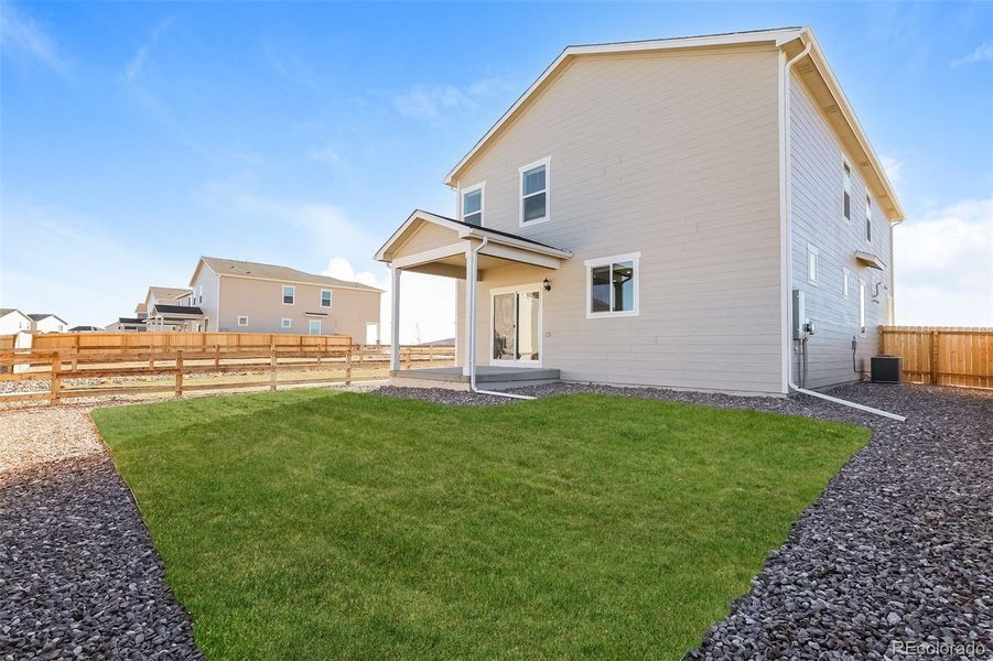 Exterior details and patio area of a home in Second Creek Farm, Commerce City (Image 3).