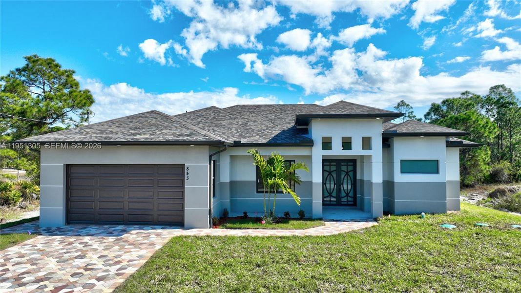 Front exterior of a new home in , Lehigh Acres, FL, highlighting curb appeal (Image 29). Front exterior of a new home in , Lehigh Acres, FL, highlighting curb appeal (Image 29).