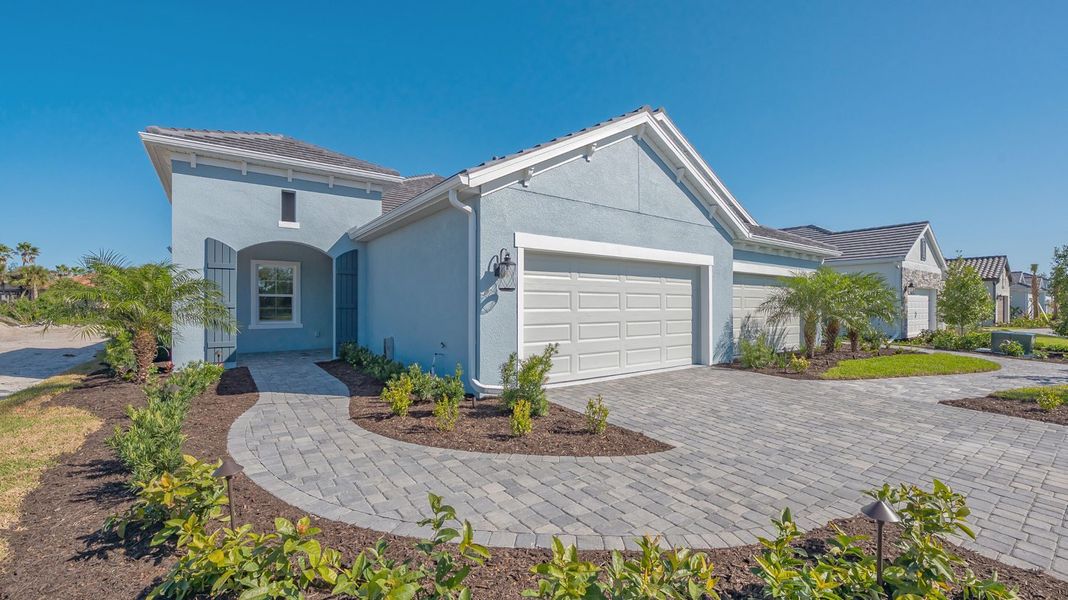 Representative exterior photo of a completed home built from the Sandcastle 2 by Neal Communities in Boca Royale Golf & Country Club at Wellen Park, Englewood, FL (Image 2).