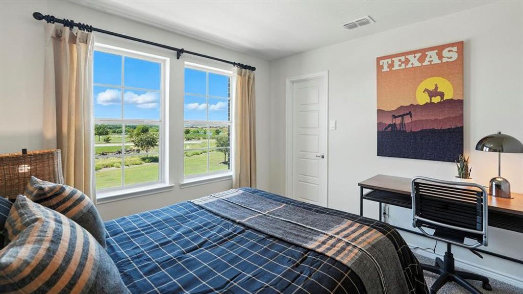 Bedroom featuring carpet flooring and an office area