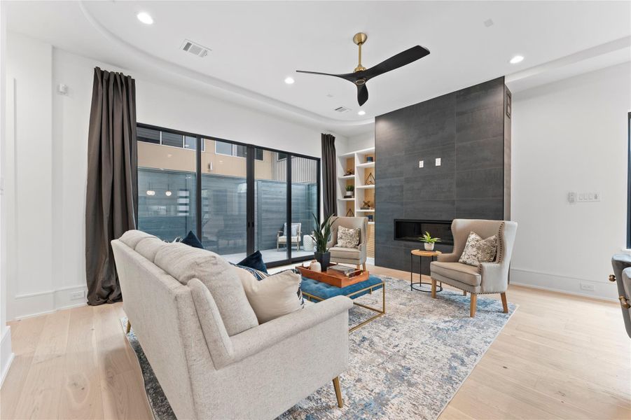 Bright and inviting living space with floor-to-ceiling windows w/pre wired sound system.