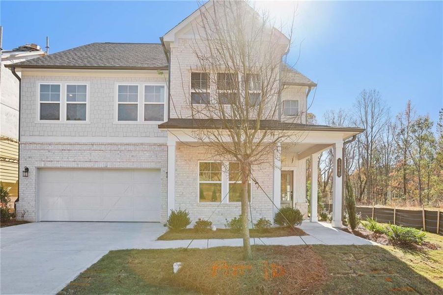 Front exterior of a new home in Arbors at Richland Creek, Buford, GA, highlighting curb appeal (Image 2). Front exterior of a new home in Arbors at Richland Creek, Buford, GA, highlighting curb appeal (Image 2).