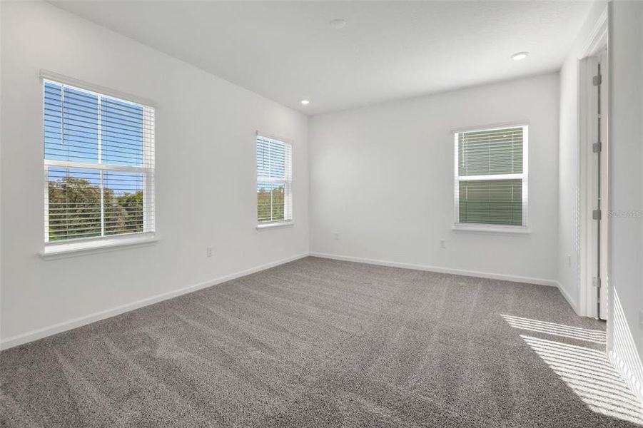 Spacious, unfurnished interior of a new home in Serenade at Ovation, Winter Garden (Image 32).