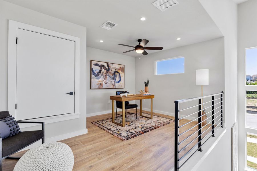 Home office with recessed lighting, light wood-style floors, and a ceiling fan
