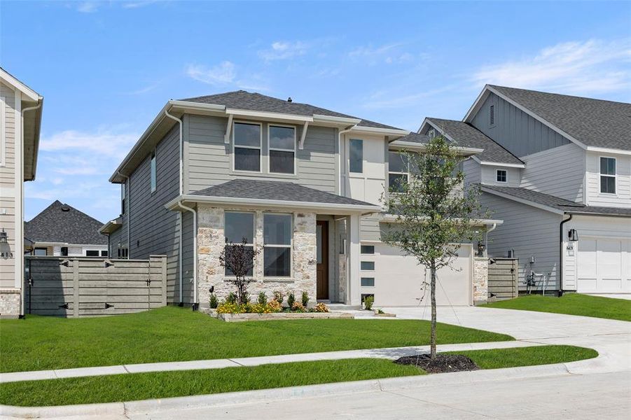 Front exterior of a new home in Treeline, Justin, TX, highlighting curb appeal (Image 1).