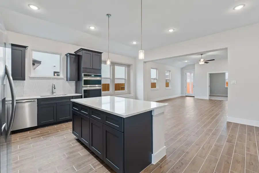 Representative furnished interior of a home built from the Lexington 2012 S 3CG by Saratoga Homes in Enclave at Cele, Pflugerville (Image 8).
