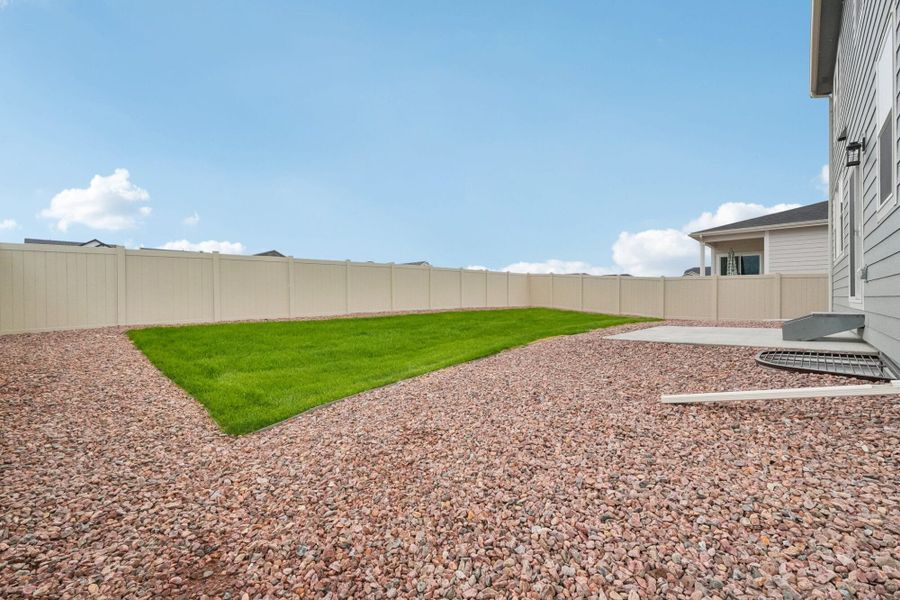 Exterior details and patio area of a home in The Trails at Aspen Ridge, Colorado Springs (Image 29).