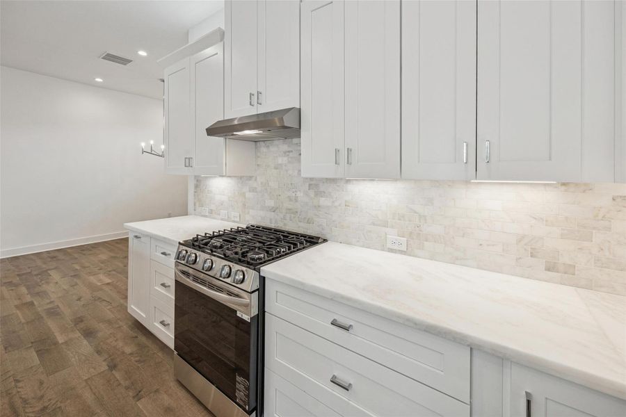 Cabinets to the Ceiling * Marble Backsplash * Marble Counters * Lots of Cabinets and Drawers.