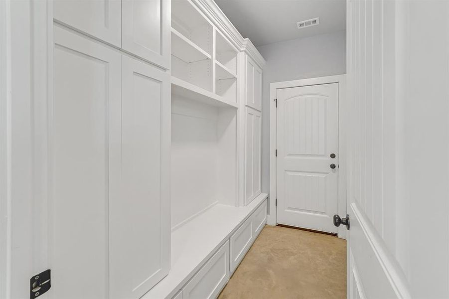 Mudroom with concrete floors
