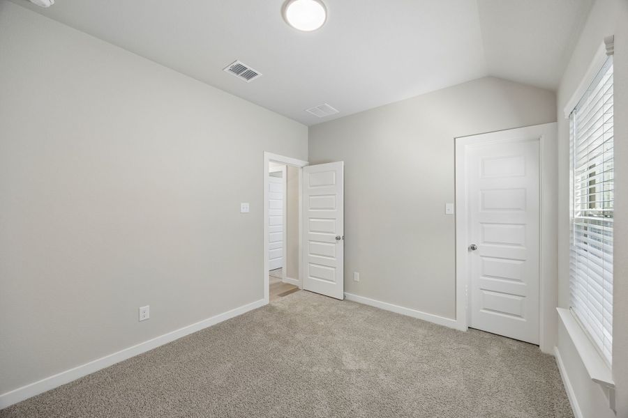 Bedroom in the Emmy II home plan by Trophy Signature Homes - REPRESENTATIVE PHOTO