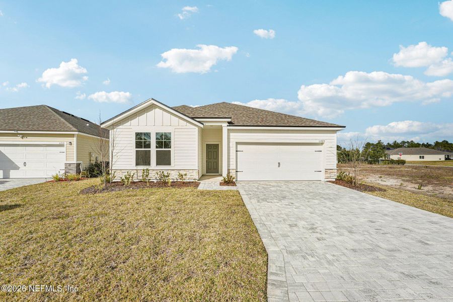 Front exterior of a new home in Panther Creek, Jacksonville, FL, highlighting curb appeal (Image 16).