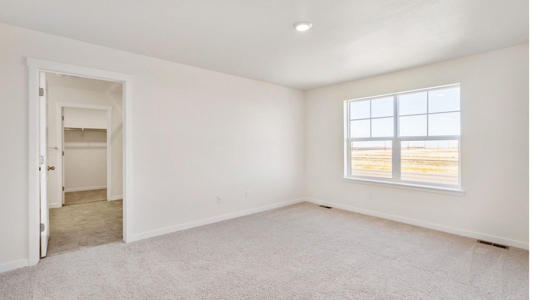 Spacious, unfurnished interior of a new home in The Ridge at Lorson Ranch, Colorado Springs (Image 11).