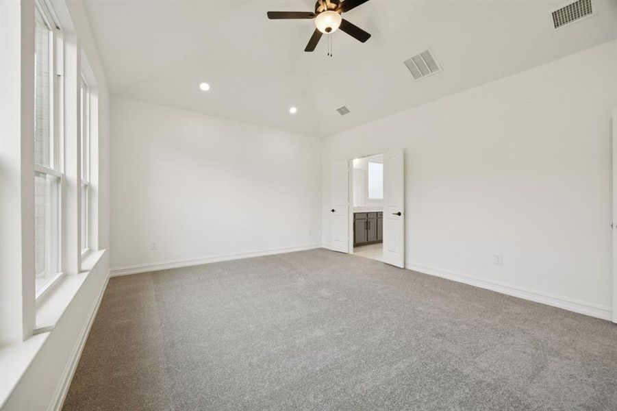 Spacious owner's suite with private bath. * Model representation.
