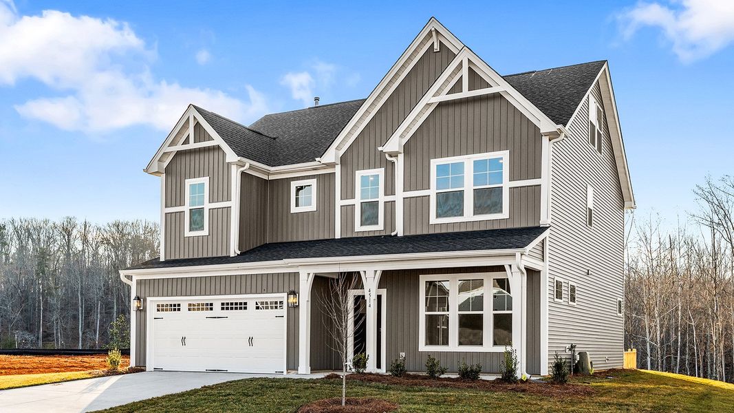 Front exterior of a new home in Hanes Lake, Winston-Salem, NC, highlighting curb appeal (Image 28). Front exterior of a new home in Hanes Lake, Winston-Salem, NC, highlighting curb appeal (Image 28).