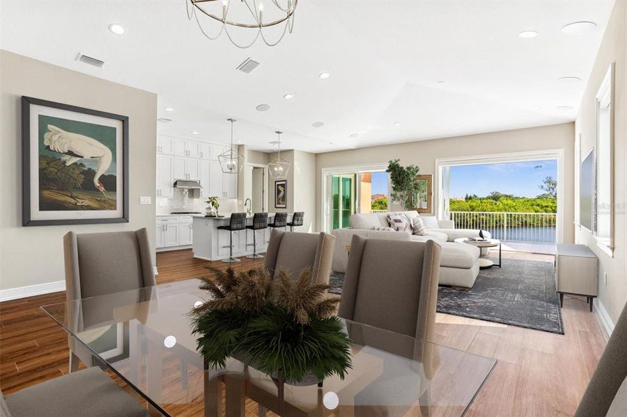 Virtually Staged Dining Room, Great Room and partial Kitchen.