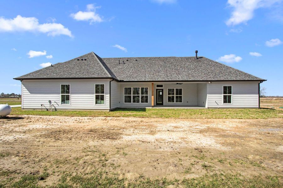 Front exterior of a new home in , Dayton, TX, highlighting curb appeal (Image 2).