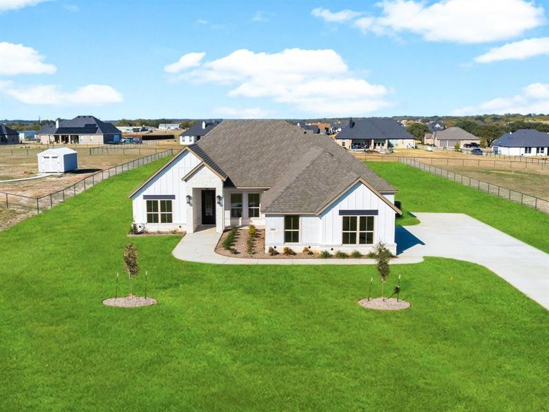 Front exterior of a new home in , Weatherford, TX, highlighting curb appeal (Image 24).